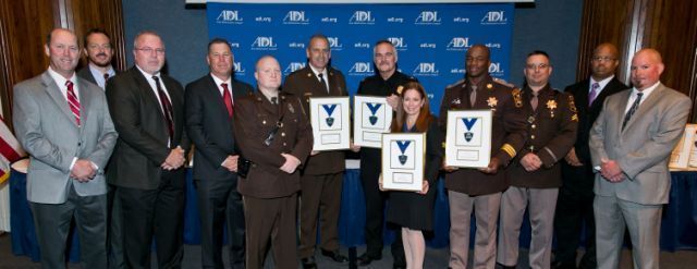 CCSO Cpl. Richard Boggs, third from the right, and members of the police department, sheriff's office, and state's attorney's office in Montgomery County, are presented awards from the Anti-Defamation League. CCSO Major Marvin Butler, fourth from right, is also pictured.
