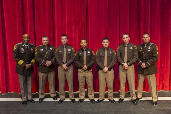 Sheriff Troy Berry, Sgt. H. Ivers, M/Cpl. J. Piazza with police graduates  